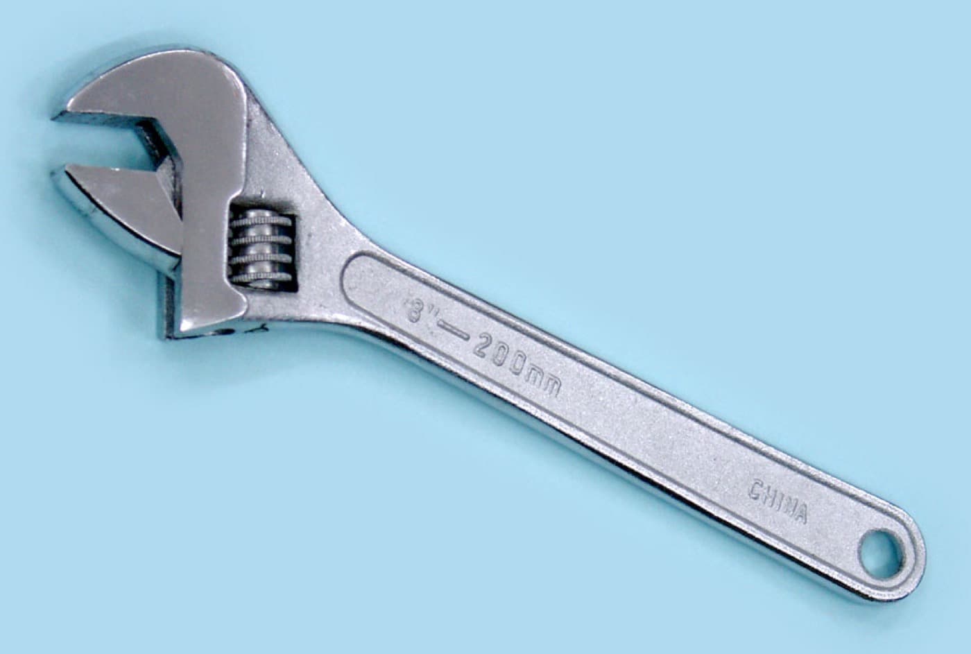 An adjustable wrench, also known as an adjustable spanner.