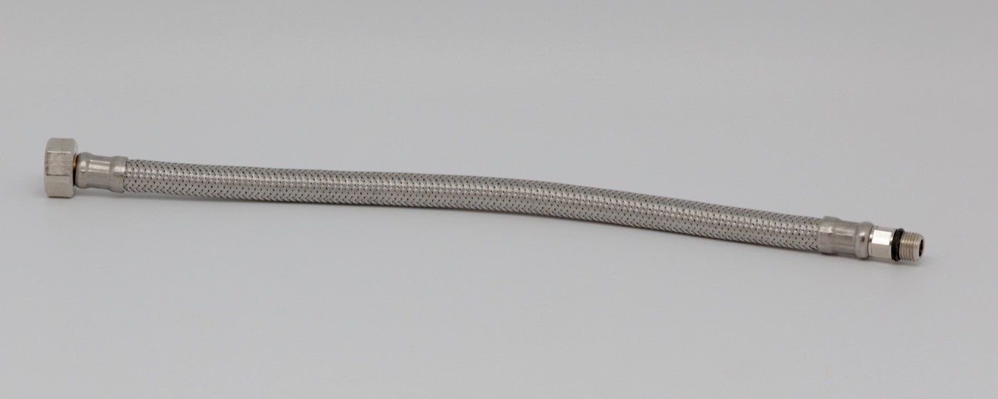 A new flexible plumbing hose with a brass fitting nut at one end.